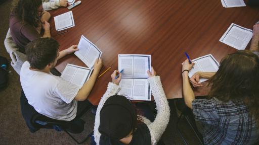 Shimer Students discussing an essay at a round table 